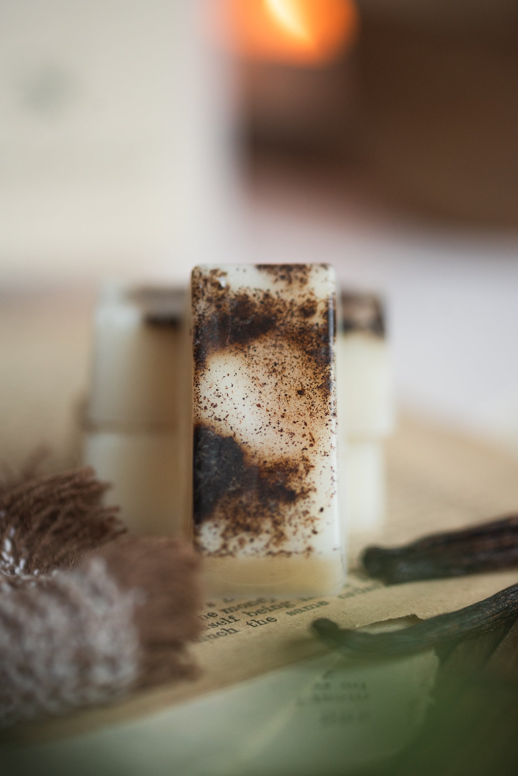 Close-up of wax melt with a decorative brown vanilla bean surface